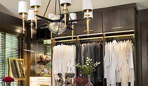 A cashmere cape hangs from a telescoping valet rod. Custom Closet She Had Always Wanted Susan Ferrier California Closets