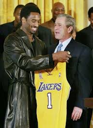 Los Angeles Lakers Guard Kobe Bryant Holds Up Jersey To President George Bush Chest Kobe Bryant Kobe Bryant Black Mamba Kobe Bryant 24