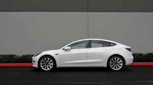 To go with the removal of shiny bling on the outside of the model 3, the interior has lost the shiny black plastic surfaces on the central console, as well as some of the silver. 35 000 Tesla Model 3 Arrives With 220 Mile Range And A 1 200 Asterisk