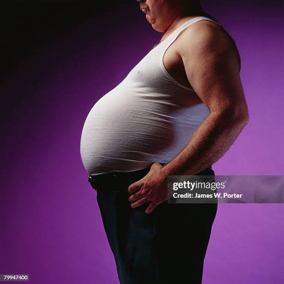Profile Of Mans Beer Belly High-Res Stock Photo - Getty Images