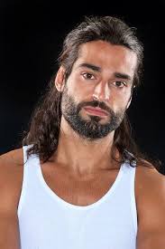 Maditerranean Man Posing On Black Background Olive Complexion Dark Brown Skin Tone Long Hair Styles Men