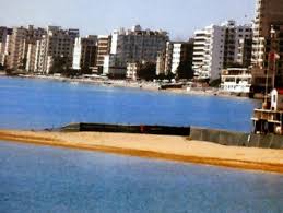 Nicosia, cyprus (ap) — the pristine, azure waters lapping at the skirts of uninhabited varosha contrast sharply with the dilapidated, crumbling buildings lining the beachfront of this abandoned suburb of famagusta. Famagusta Beach 14 Cyprusscene Com