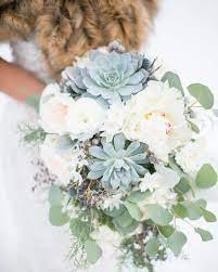 Maybe you would like to learn more about one of these? Blue White And Green Winter Bridal Bouquet Featuring Succulents Peonies Ranunculus And P Winter Wedding Bouquet Bridal Bouquet Peonies Winter Bridal Bouquet
