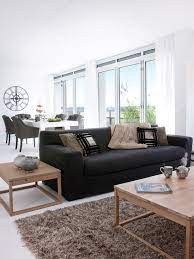 This But With Many Green Plants And Flowers Around Black Furniture Living Room Black Sofa Living Room Modern Living Room Interior