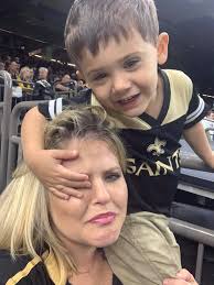 When you take your kids to the Saints game.... (and try to get a picture)