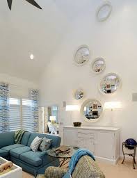 Color is always a good way to accentuate height and help just like with an accent wall, you can make the ceiling stand out by using a special texture. Remodelaholic 24 Ideas On How To Decorate Tall Walls In 2020 Tall Ceiling Living Room Vaulted Ceiling Living Room High Ceiling Living Room