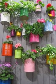 Recycled Cans And Little Bit Paint So Colorful And Cute Great Idea For A Little Herb Garden Cute Garden Ideas Vintage Garden Decor Garden Projects