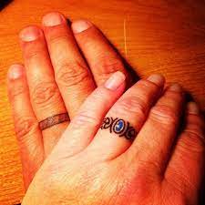 32 Couples Who Gave Up Their Engagement Rings For Tattoos Tattoo Wedding Rings Wedding Ring Tattoo Ring Finger Tattoos