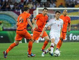 Players From The Dutch National Football Team Wearing Orange Vs Denmark Euro 2012 National Football Teams Euro 2012 Orange Color