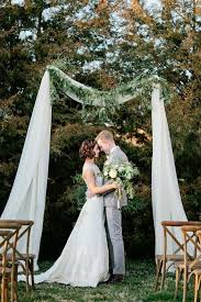 How to use tulle for wedding decorations. Earthy Elegant Wedding Inspiration From Kristyn Hogan Tulle Wedding Decorations Wedding Arch Tulle Wedding Ceremony Arch