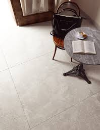 Porcelain floor and wall tile combines a glazed top with a medium sheen and subtle gray/black variations in tone to create a perfect look for a variety of decorative schemes. Ceramicas Aparici