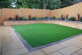Artificial Grass Laid In Square Back Garden Make Your Home Design Dreams Come Tr Backyard Raised Garden Backyard Raised Garden Beds Small Backyard Landscaping