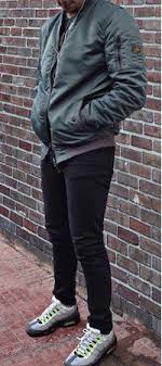 Men S Grey Neon Air Max 95 Trainers With Black Jeans And Green Bomber Jacket Outfit Nike Air Max Mens Air Max Outfit Nike Air Max
