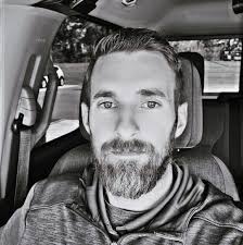 Which style of mini skid does less damage to grass, tracks or tires?