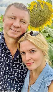 Pictured: Lawyer swept to her death in front of her children when she  jumped into a Russian ice hole