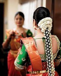 South Indian Wedding Hairstyles For Long Hair Chignon Hairstyle In 20 Bridal Hairstyle Indian Wedding Bridal Hair Decorations South Indian Wedding Hairstyles