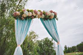 Maybe you would like to learn more about one of these? Beautiful White Wedding Arch Decorated With Purple And White Flowers Outdoors Near The Willow Tree Stock Photo Picture And Royalty Free Image Image 55537199