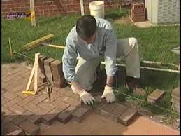 Continue setting the pavers, working toward the middle of the patio area and leaving a small gap — 1/4 inch here — between the pavers. Install Your Own Brick Patio Youtube