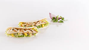 Store cooked tortillas in a kitchen. Grilled Fish Taco With Mango Slaw Mindful By Sodexo Canada