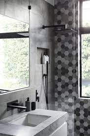 Black and white modern bathroom. Matte Black Accents Add Sophistication To This Grey And White Bathroom Gray And White Bathroom Bathroom Interior Design Grey And White Bathroom