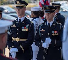Service members line up before U.S. Secretary of Defense
