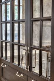 Sea shells, old clocks, holiday mementos. Mirrored Kitchen Cabinet Doors Design Ideas
