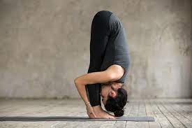 This asana closely resembles the hands to feet pose or the padahastasana with the sole difference in the positioning of the hands. Standing Forward Bend Uttanasana Learn Step By Step Lessons Com