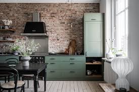 A Swedish Apartment With A Green Kitchen And Exposed Brick The Nordroom Brick Wall Kitchen Brick Kitchen Green Kitchen Designs