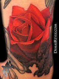 Tattoo flaming heart bound by chains of love. Kingdom Studio Tattoos Nature Burning Rose Tattoo
