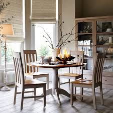 We import solid oak dining tables and chairs direct from manufacturers in large quantities which means that we can pass on big savings to our customers. Effortlessly Classic And Traditional This Round Oak Dining Table And Chairs Is The Perfect Ad Round Oak Dining Table Neutral Dining Room Dining Room Furniture
