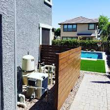 This cinder block wall construction would have 3 sides, all 5' high. C E Builders Cedar Pool Equipment Fence Why Look At Facebook