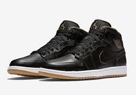 Air Jordan Retro 1 Black And Gold This Black And Gold Air Jordan 1 Mid Is For The Kids Air Jordans Black And Gold Jordans White Basketball Shoes