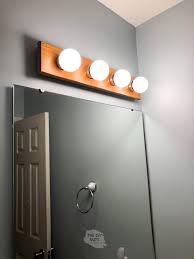 With a few diy supplies, you can create a drum shade that slips over a hollywood light, blocking the fixture from view. How To Cheaply Modernize Update Your Old Bathroom The Diy Nuts