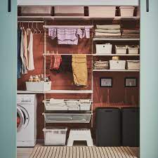 A wasted space laundry room is transformed by fun wallpaper and ikea storage. Pin En Wall Inspirations