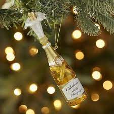 Champagne has put on its party clothes for the holiday season! Glass Champagne Bottle Ornament Gold Christmas Decorations Gold Christmas Glass Ornaments