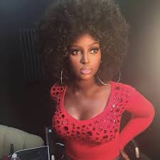 Beautiful black hair lady latina mexican woman on the sea background looking at you lovely. This Afro Latina Singer Had The Best Response After She Was Compared To Food And Shamed For Her Hair