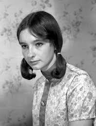 Perhaps someone recognises this pensive young lady