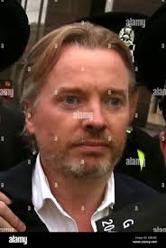 NOTE ALTERNATIVE CROP Former owner of Glasgow Rangers, Craig Whyte (centre)  leaves Glasgow Sheriff Court after he appeared as part of a Police Scotland  investigation into Rangers football club Stock Photo -