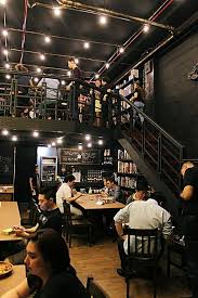 dyce n dyne eat and play at this new steampunk themed boardgame bar and cafe cafe design cafe interior design board game cafe