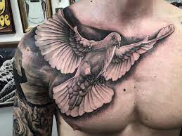 Eagle bird tattoos for men on chest. 14 Dove Tattoos With Powerful Meaning Tattooswin Dove Tattoos Chest Tattoo Men Cool Chest Tattoos