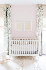 White And Blush Pink Nursery Features A White Wooden French Crib Against A Blush Pink Wall Flank Girl Nursery Pink Nursery Curtains Girl Pink And Green Nursery