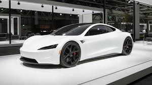 Tesla Brought Out A White Roadster To The Grand Basel Car Show In Switzerland Marking The Electric Sports Tesla Roadster New Tesla Roadster Sports Cars Luxury