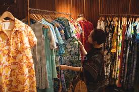 Hammock hangers and supports,hammock hangers at family dollar,hammock hangers. Woman Selecting Clothes On Hangers At Apparel Store Shopping Multicolored Stock Photo 228980494