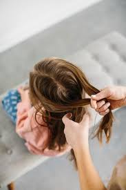 Take the section of hair from the left and cross it over in between the right and center. 3 Easy Hairstyles For Kids Braids Buns And Wavy Hair The Effortless Chic