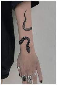 25 Meaningful Snake Tattoo 2020 Snake Wrapped Around Wrist Tattoo Snakewrappedaroundwristtatto Tattoos Wrist Tattoos For Women Wrap Around Wrist Tattoos