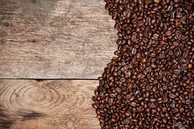 Epoxy coffee table made from beans is a project we built with the burl hunter. Coffee Beans On Old Wood Table Top View Stock Photo Picture And Royalty Free Image Image 33012275