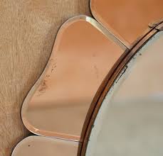 Inspired by the 1960's, this mirror adds a modern twist to a classic retro style. Large Sublime 1930 S Art Deco Peach Glass Bevelled Venetian Round Petal Mirror Wimbledon Furniture