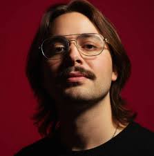 A group of American soldiers bow their heads as Chaplain 1st Lt. Harvey  Floyd Bell says grace prior to eating Christmas dinner near the Italian  front. Photo taken