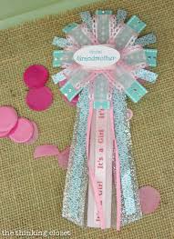 How to make a baby shower corsage or mum using a store bought button pin ribbon. Cute As A Button Baby Shower The Thinking Closet