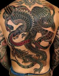 The tiger fights in a. Battle Royale Tattoo Traditional Back Tattoo Eagle Dragon Snake Traditional Back Tattoo Back Tattoos For Guys Tribal Back Tattoos